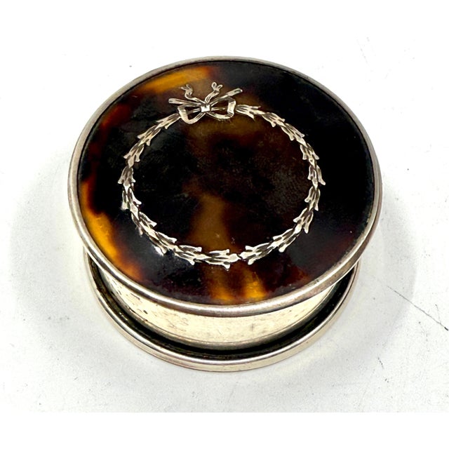 A nice pair of horn of silver snuff or trinket boxes. One is hallmarked with English Sterling hallmarks the other I...