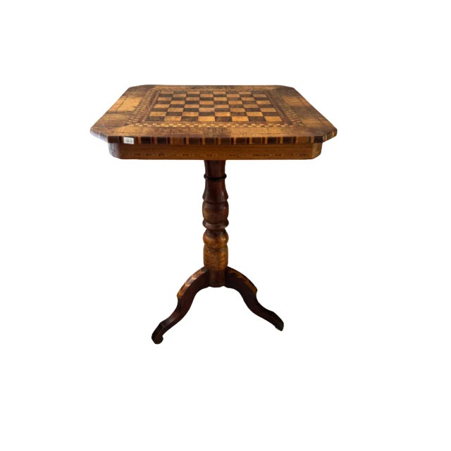 Square Rolo coffee table with top inlaid in various checkerboard essences, 19th century. Turned and inlaid central leg...