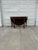 We have a beautiful vintage Federal Revival mahogany drop leaf dining table for sale! This classic gateleg table features...