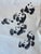 This vintage ink painting by J.P.Gaston features a whimsical and dynamic grouping of pandas rendered in traditional...