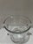 Elegant clear crystal or heavy glass ice bucket with applied scroll handles, vertical cut or optic ribbed sides, and a...