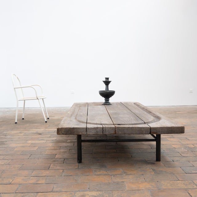 The thick, highly textured oak top features beautiful natural wear, with cracks, old marks, irregularities and a greyed...