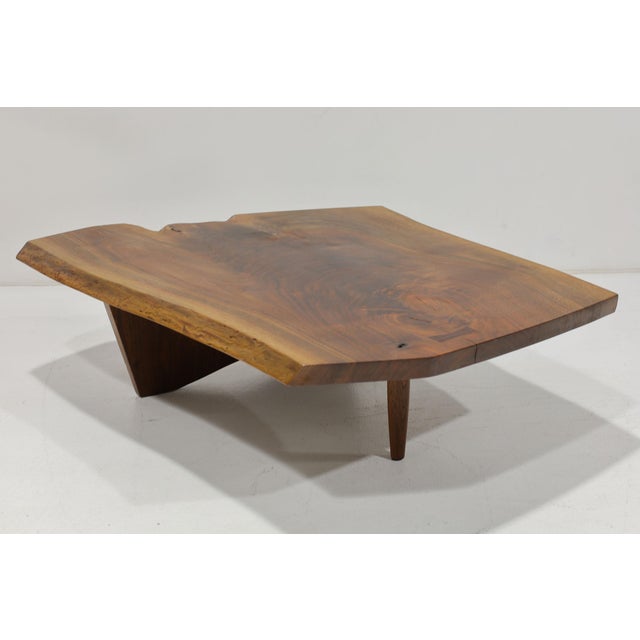 Introducing the Mira Nakashima Conoid Slab Cocktail Table in Black Walnut and Rosewood, a true testament to mid-century...