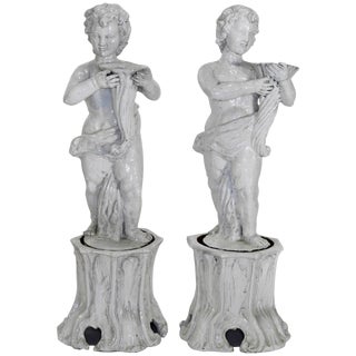 Pair of 19th Century Italian Glazed Terracotta Cherubs on Tree Trunk Pedestals For Sale