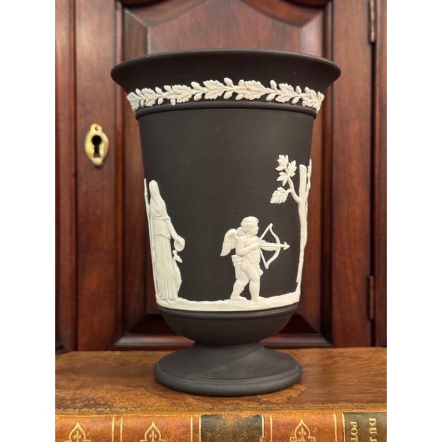 Wedgwood Jasperware black pedestal footed vase in excellent vintage condition. Classical scene including even a butterfly...