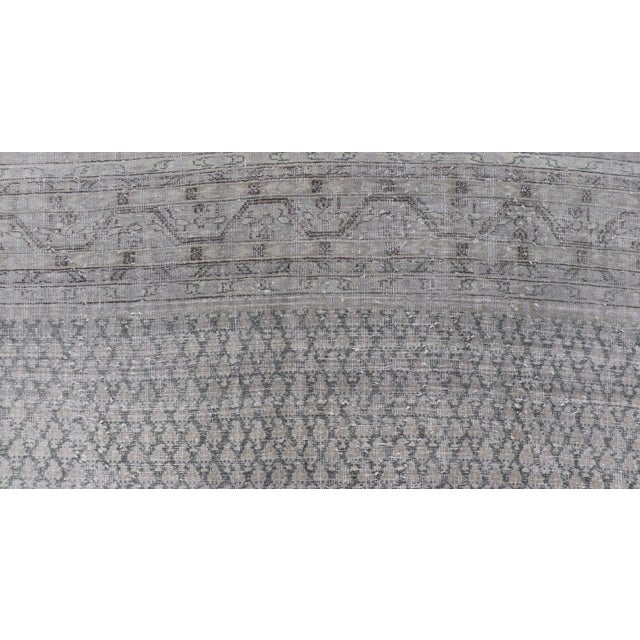Distressed Persian Antique Tabriz Carpet With Muted Floral Design in Light Gray For Sale - Image 4 of 11