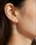 Elegant 14K white gold dangle earrings featuring a floral-inspired design with 12 brilliant round diamonds totaling 0.5...