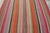 Handwoven in wool circa 1950–1960, this 5x5 vintage Kilim, woven in the tradition of a Frazada textile, is a vibrant and...
