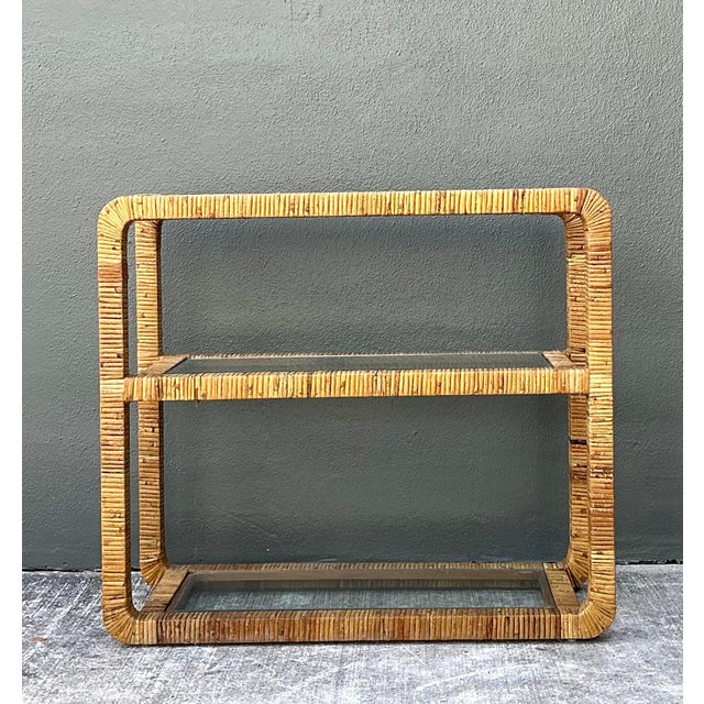 This elegant vintage etagere is a masterclass in Hollywood Regency and Palm Beach design, offering a sophisticated blend...