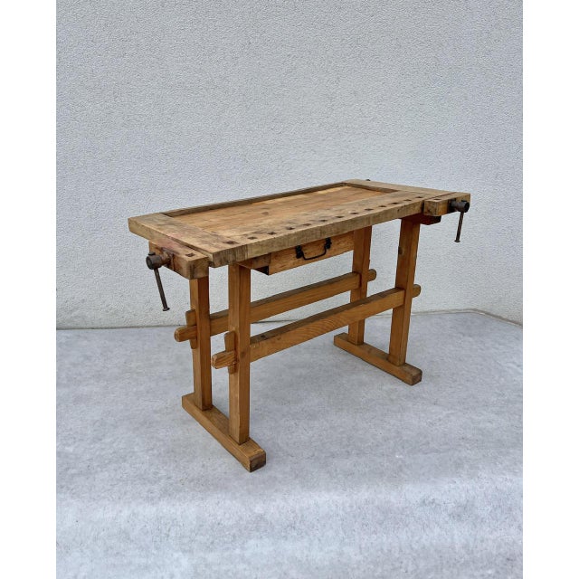 Vintage French children's carpenter's workbench from the 1950s. Crafted from solid pine and featuring two sturdy iron...