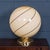 A striking murano glass globe table lamp, produced in venice, italy, circa 1980. The large spherical shade is beautifully...