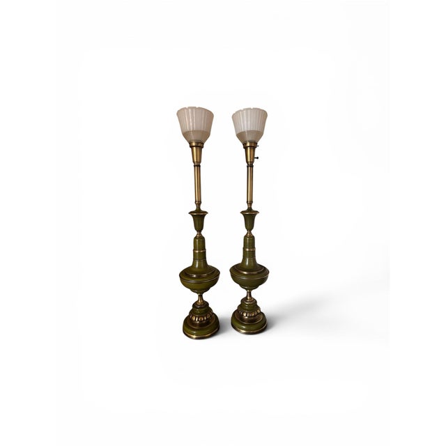 A striking and increasingly sought-after pair of vintage Rembrandt Lamp Company torchiere-style buffet lamps, showcasing...