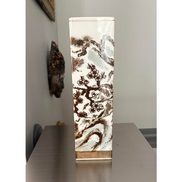 Elevate your interior styling with this striking mid-century Japanese porcelain square sleeve vase. Standing nearly a foot...