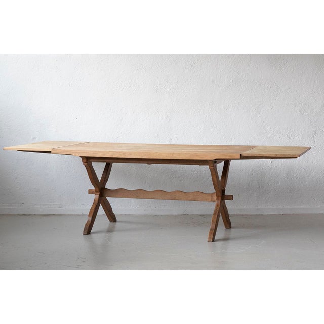 The table measures 160 cm in length and includes two additional pull-out extension leaves, each measuring 45 cm. When...