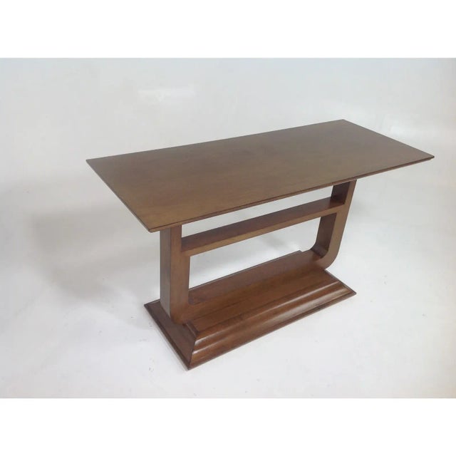 Custom made modern mid century style console. The console is done in a light walnut finish. The piece has a unique look...