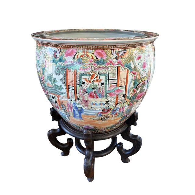 Superb large chinoiserie Rose Medallion porcelain goldfish planter on a black wood stand, circa mid-20th century....