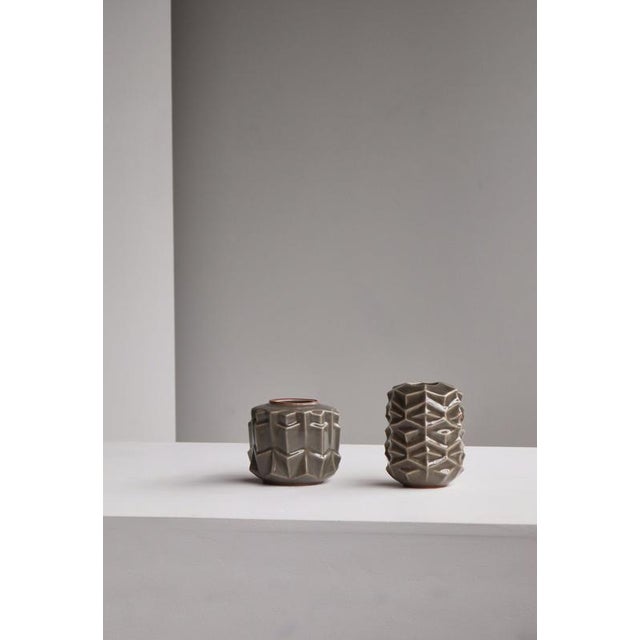 Pair of 1960s stoneware vases by Melike Abasiyanik for Royal Copenhagen, Denmark. Sculpturally textured forms with...