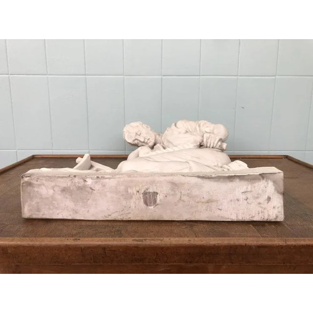 Antique Statue In plaster enameled exterior. Sculpture depicting a Peasant with plow. Sculpture Signed on one edge (it...