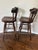 A handsome matched pair of vintage Ethan Allen Old Tavern swivel bar stools, model 12-9505, combining classic Early...