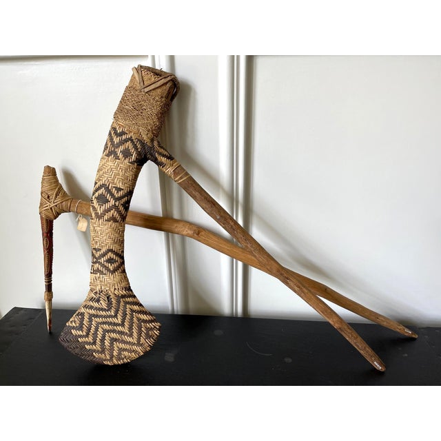 Two Oceanic ceremonial weapons from PNG highlands circa 20th century. It consists of two pieces. The first is an ax with a...