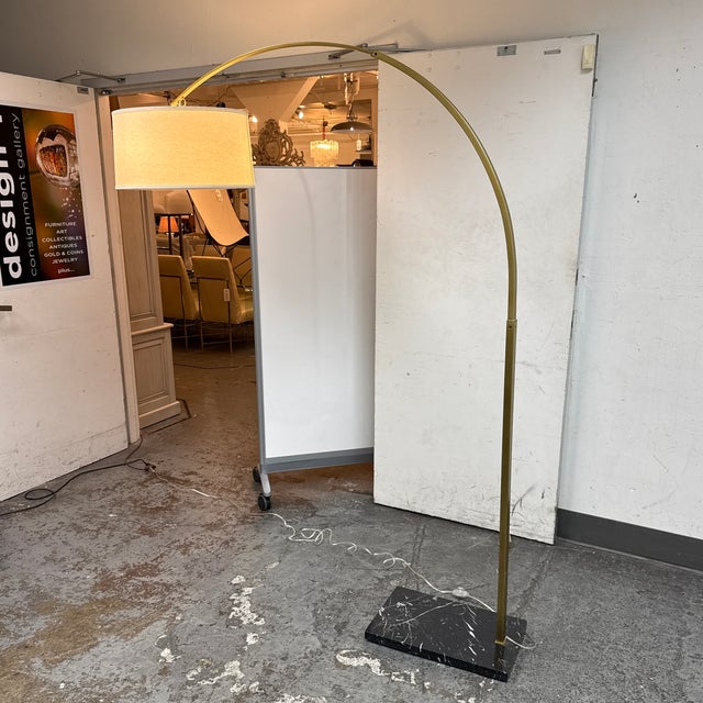 Design Plus Gallery presents the Modern Arc Floor Lamp + Black Marble from Restoration Hardware The lamp has a brass-toned...