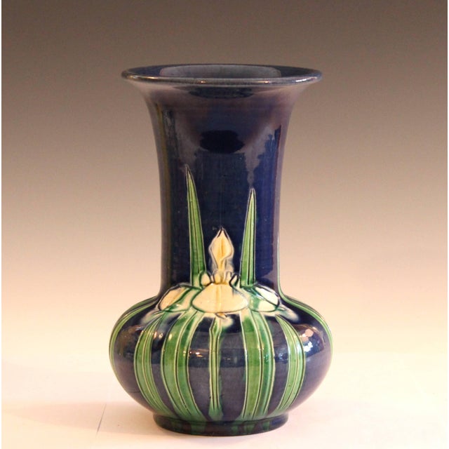 Awaji pottery trumpet form vase with incised iris design on unusual blue ground, circa 1920. Measure: 8 1/4" high, 6"...