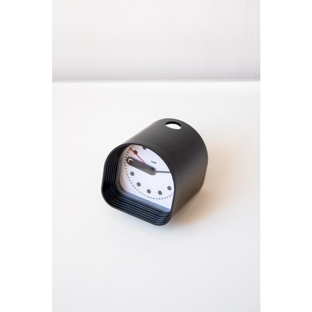 Precise, sculptural, and a collector's item, this table alarm clock is the optic model by joe colombo for the italian...
