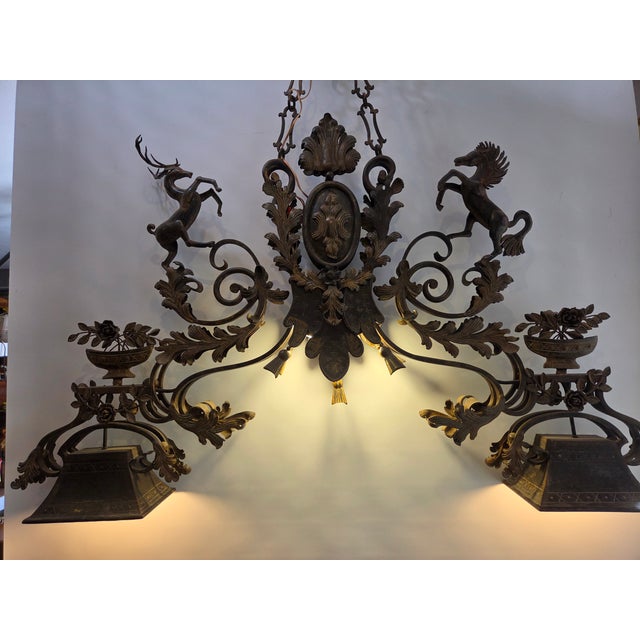 Vintage Wrought Iron Hand Forged Light. This light has 2 center bulbs and four outer. Double sided light. Great for...