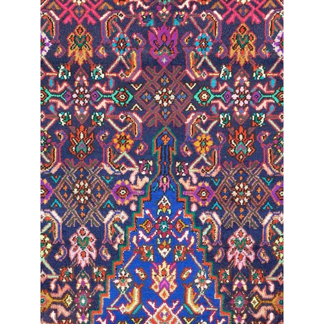 A vintage Persian hamadan rug from the mid-20th century. Hamadan town and the surrounding weaving area of about 120...