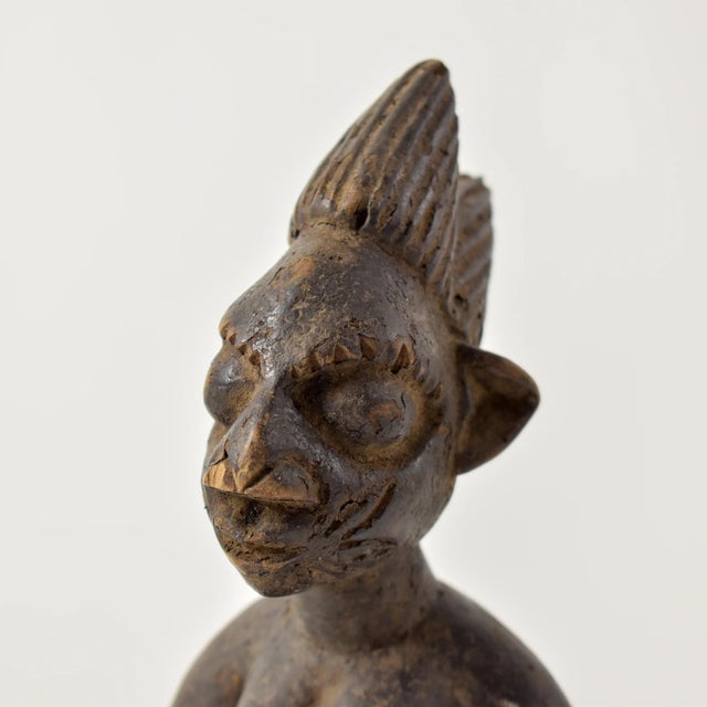Ibeji figures, carved by the Yoruba people of Nigeria, are wooden twin sculptures holding cultural significance in Yoruba...