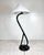 Mid century S shaped bent rattan floor lamp. Curved rattan on round wood base. Newly refinished in a glossy espresso...