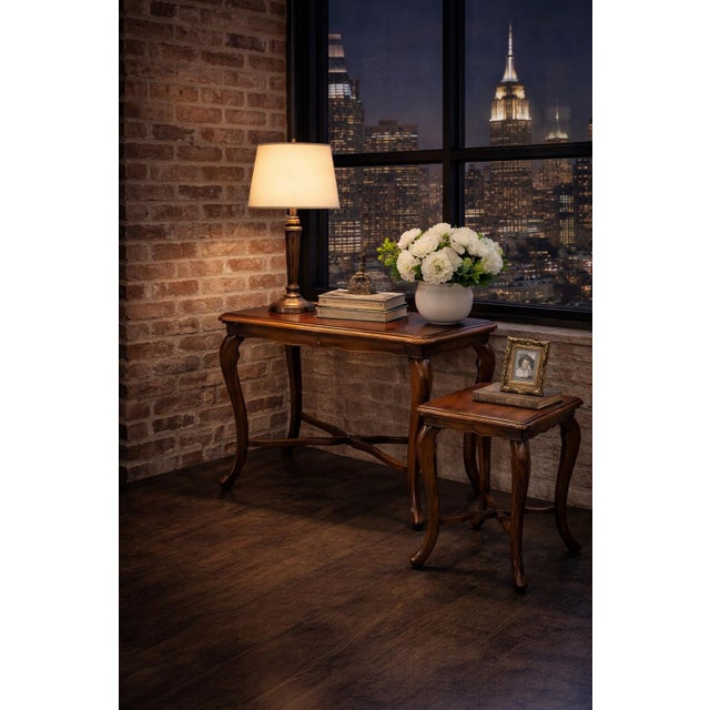 A beautifully matched pair of French Provincial tables featuring serpentine tops and carved cabriole legs, finished in our...