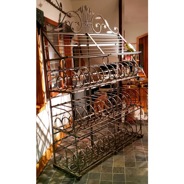 A monumentally sized 18thC French iron bakers rack for bread. This piece also make a great storage rack for wine and...
