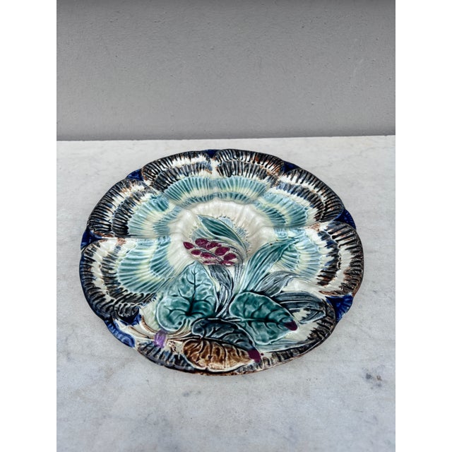 19th Century Majolica oyster plate Wasmuel (Belgium) decorated with flowers.