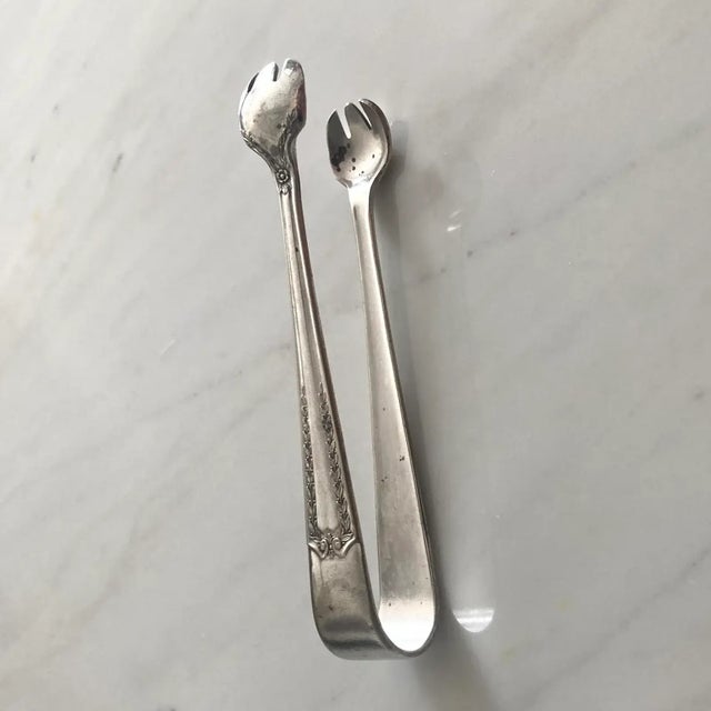 This charming piece is from the midcentury. The stainless steel sugar tongs are an elegant accompaniment to your next...
