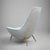Pair of stylish sculptural tall back Italian Modernist lounge chairs. Newly upholstered with brass leg details.