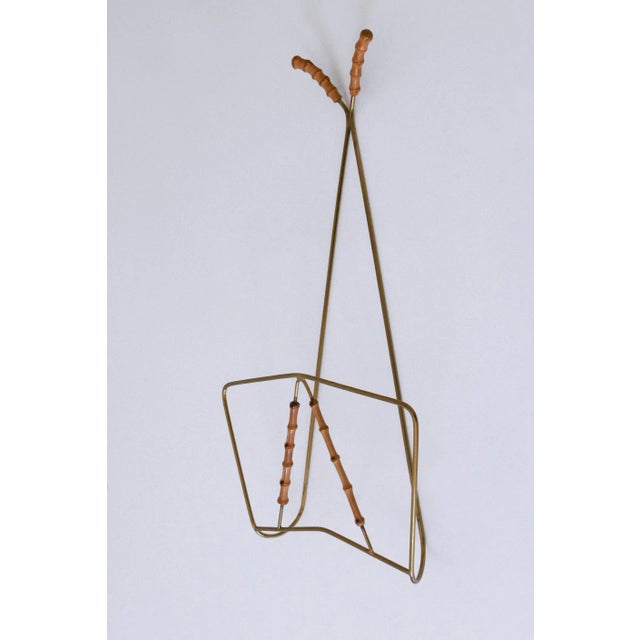 Lovely and highly decorative Mid-Century Modern wall-mounted magazine rack, 1960s, Germany. This is a very rare piece...