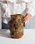 This 1900s barbotine ceramic jug from France is molded in barbotine with applied, trellised relief in honey, green and...