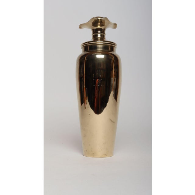 Luxurious urn-form cocktail shaker monogrammed "IK" by Dirigold (ca. 1930s, USA). Dirigold was a gold-toned alloy created...