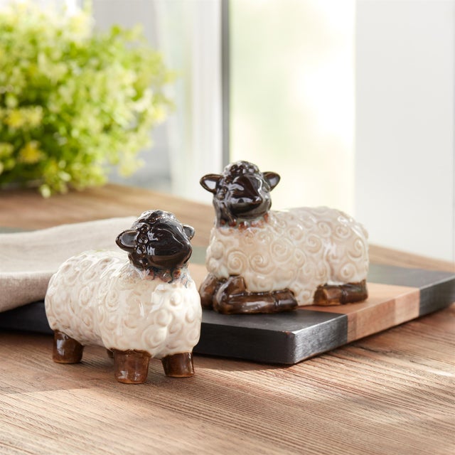 Bring a charming touch of countryside whimsy to your home with this delightful set of Mini Sheep Figurines. Crafted from...