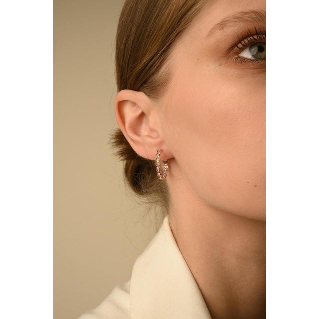 This is part of Chairish’s Fine Jewelry assortment. Pink Sapphire Hoop Earrings in 14K Gold to make a statement with your...