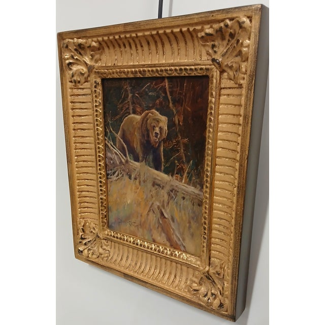Framed oil painting on board by John DeMott. Depicts image of a bear in the wild. Painting is titled "On the Alert"....