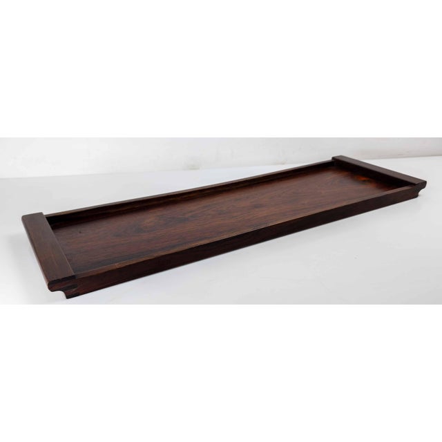 We are selling this simple and elegant Danish Modern serving tray. This tray has beautiful Rosewood grain and is made from...