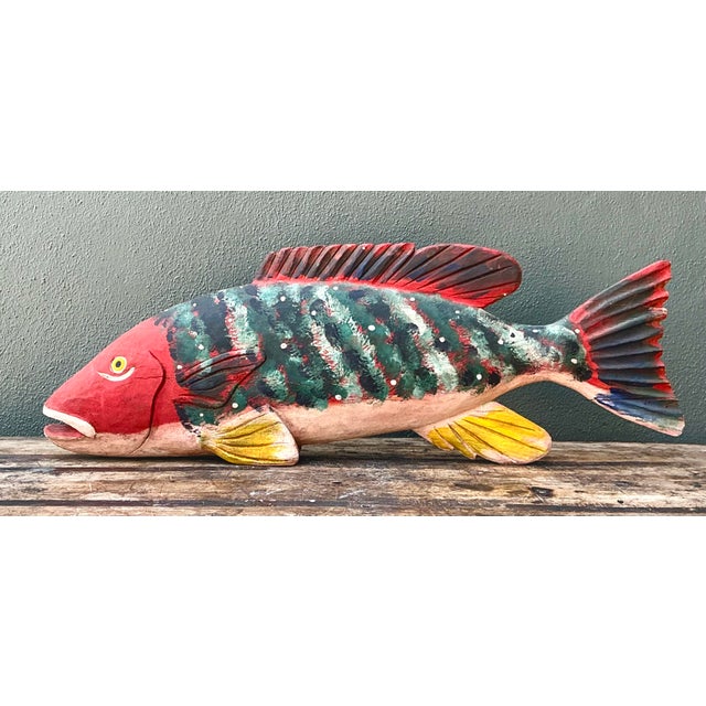 This striking monumental fish sculpture is a masterwork of coastal folk art, expertly hand-carved from solid wood. Its...