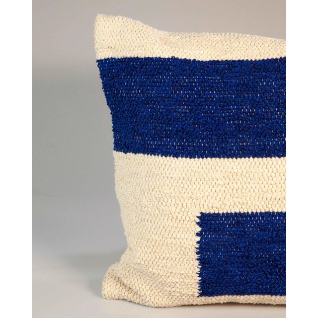 Great, bold, graphic striped pillow made of 100% re-cycled cotton left over from the fashion industry, from one of the...