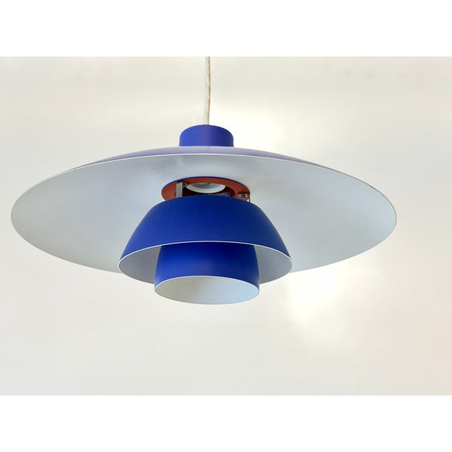 This original ph 4/3 pendant lamp was designed by danish architect and lighting designer poul henningsen and manufactured...