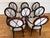 Set of 8 dining chairs, including 2 armchairs. These elegant chairs feature refined oval backs, graceful curved arms, and...
