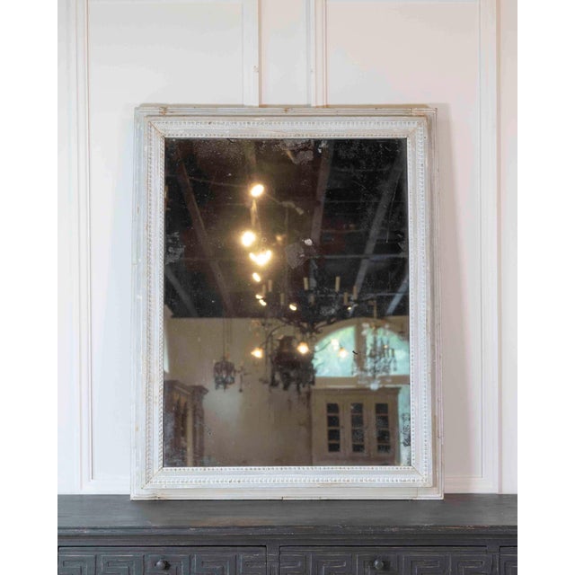 Made in France in the eighteenth century in the Louis XVI taste, this mirror retains both its original plate and its...