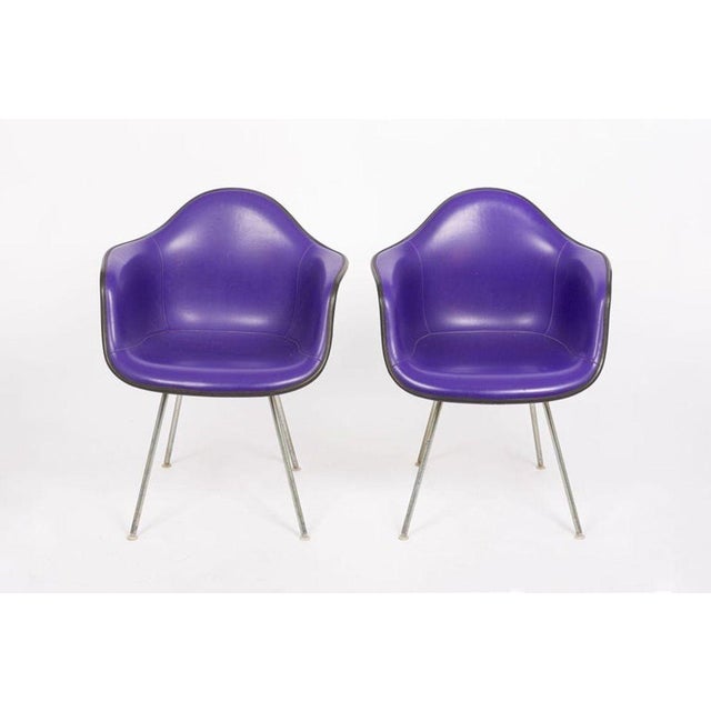 These vintage mid century modern purple DAX bucket lounge chairs were designed by Charles and Ray Eames for Herman Miller....