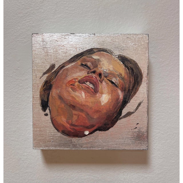 The artwork presents a close-up, expressive portrayal of a face, capturing a moment of intense emotion with its vivid...